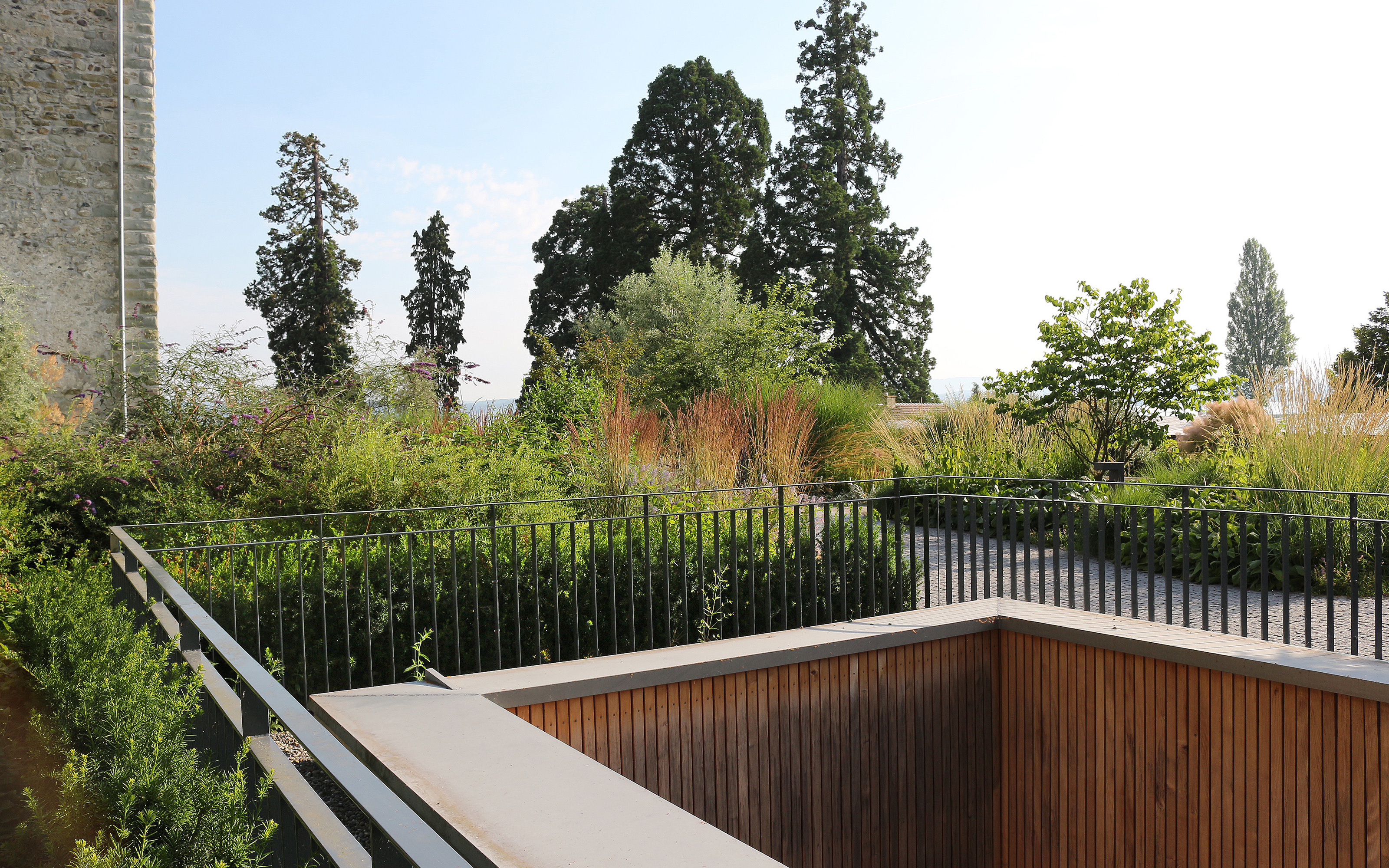 Lucious Vegetation and guardrails around an atrium